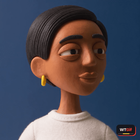 A clay figure of a young woman in a white sweater snaps her head toward the camera with wide eyes and an open mouth, silently mouthing what the.
