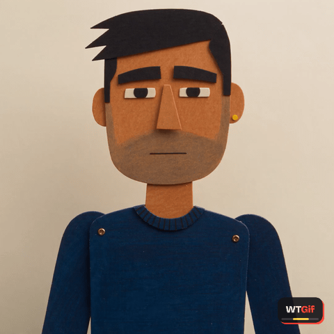 A torn edge paper cutout puppet of a broad faced man in a cobalt sweater recoils from the camera on a cream gouache backdrop as his mouth piece snaps to a curled downturned oval and one flat paper hand slides up beside his jaw.